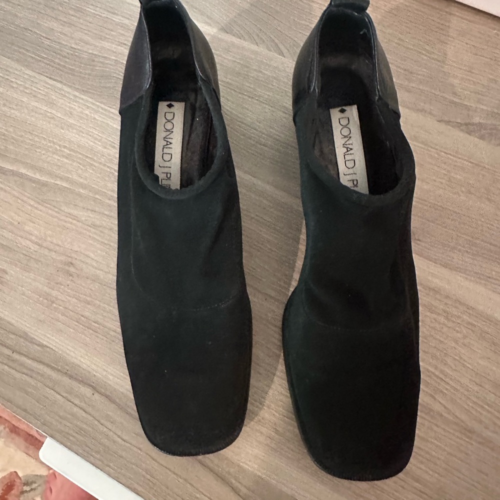 Donald Pliner black round toe block heel slip on.  Made in Italy.